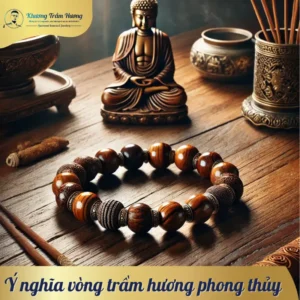 Vòng trầm hương phong thủy được đặt trên bàn gỗ, bao quanh bởi hương nhang và tượng Phật, mang lại cảm giác an lành và ý nghĩa phong thủy.